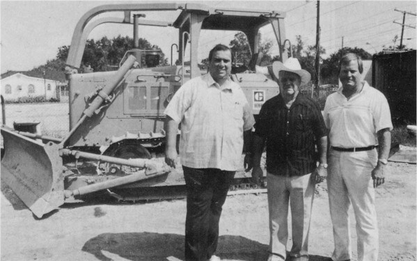 Steve, Freddy & Ed Durr in front of a bulldozer