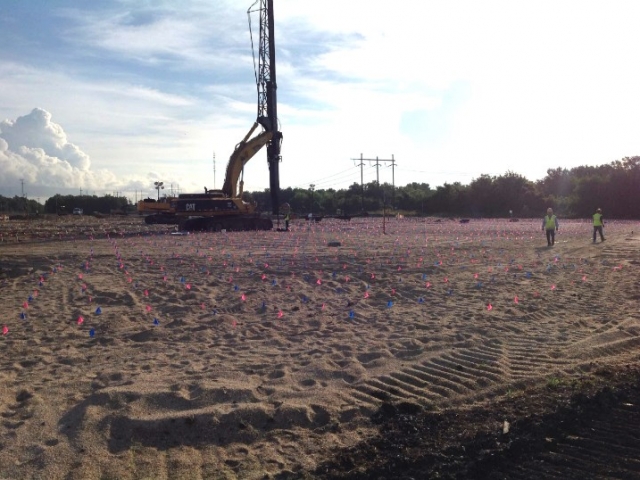 workers flag a jobsite for utility lines