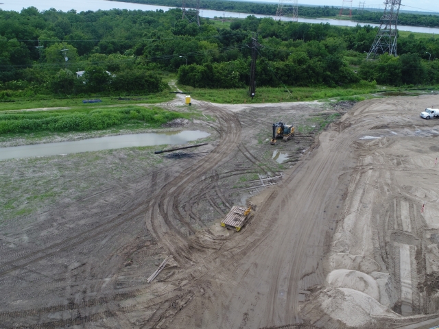 a drone shot of an excavator on a large job site
