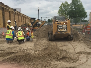 engineers huddle on a jobsite