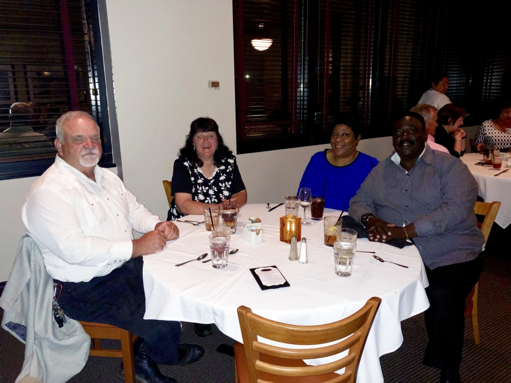 a group of employees at a celebration dinner