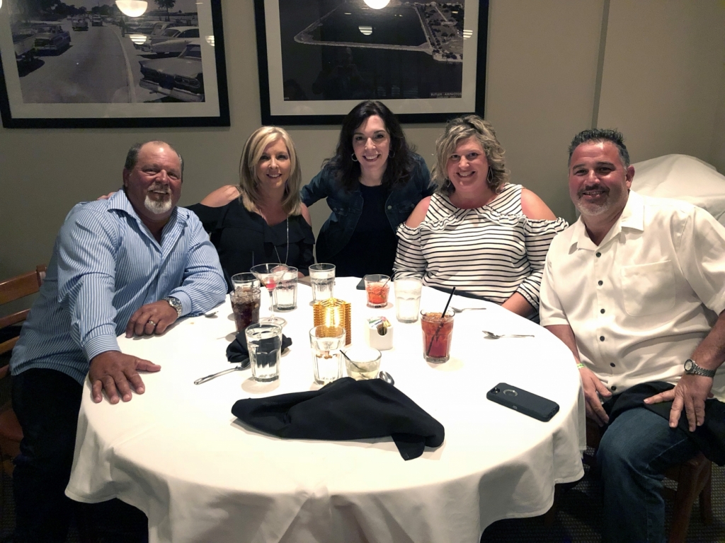 a group of employees at a celebration dinner