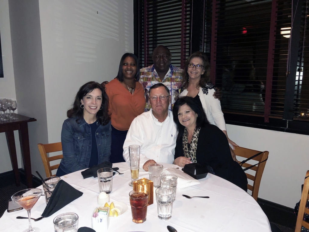 a group of employees at a celebration dinner
