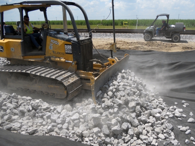 a dozer pushes crushed concrete at a job site
